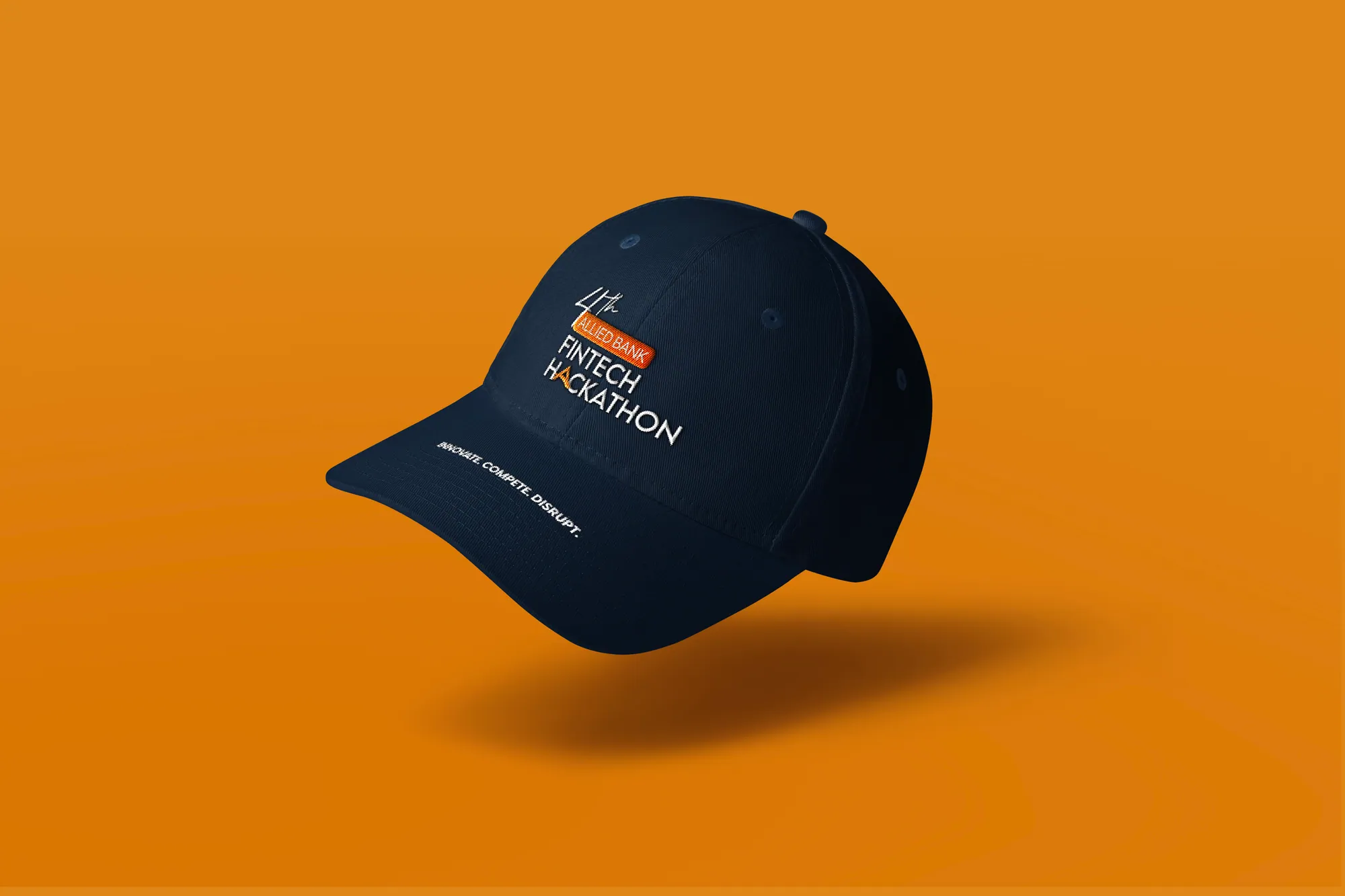 A navy cap with the hackathon mark on orange