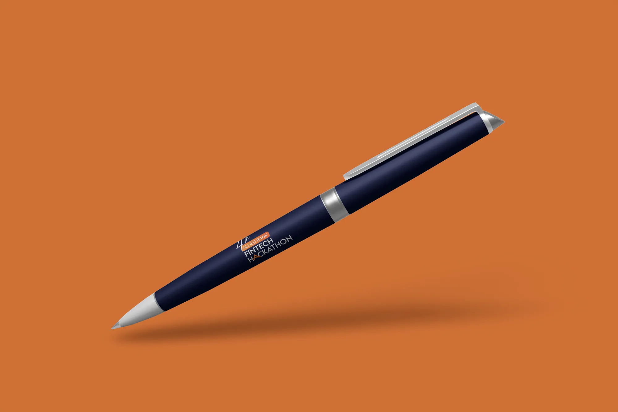 A navy pen with the hackathon mark on orange