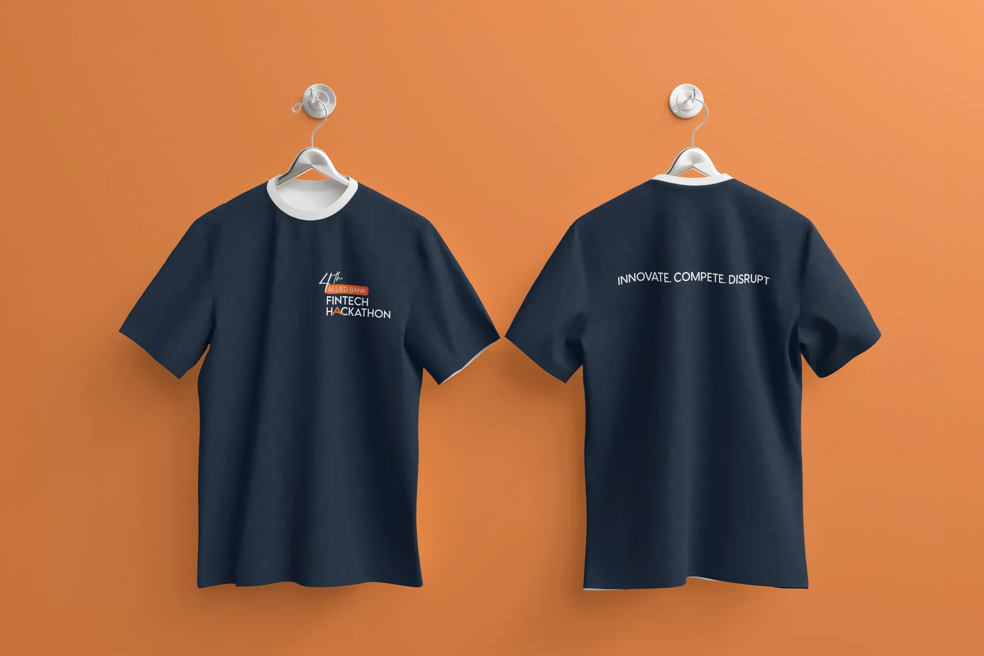 Navy hackathon T-shirts, front and back, on orange
