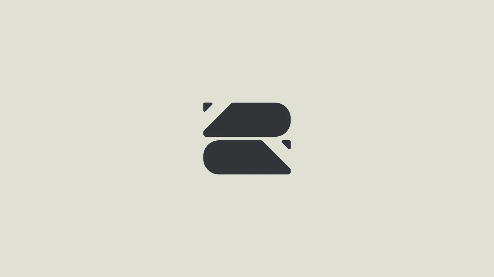Exploration: the folded-ribbon symbol alone on grey