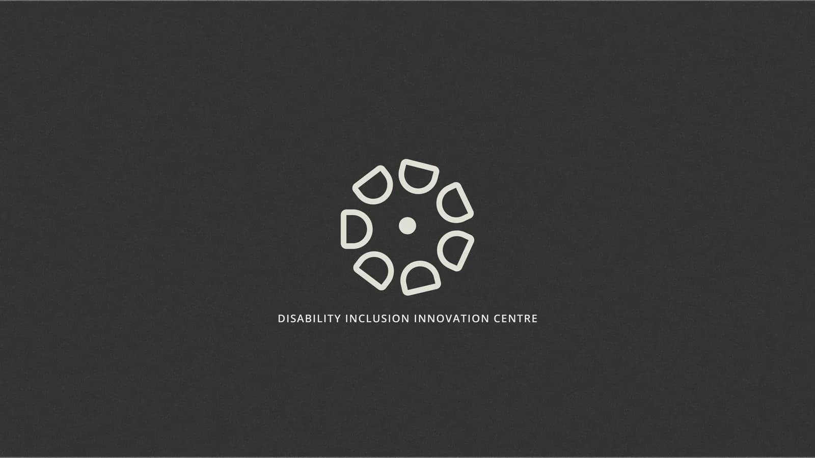 Exploration: a ring of rounded shapes around a dot, on charcoal