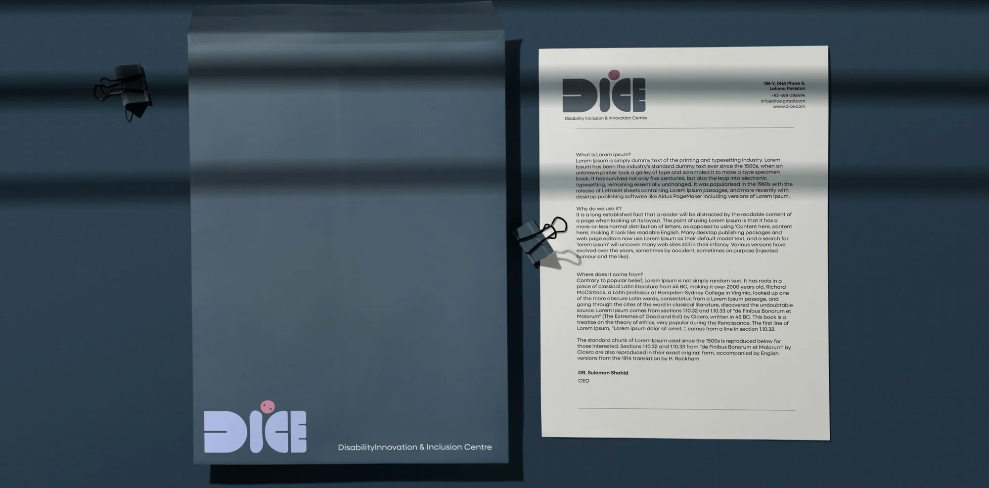 A DIICE letterhead and folder on Payne’s gray
